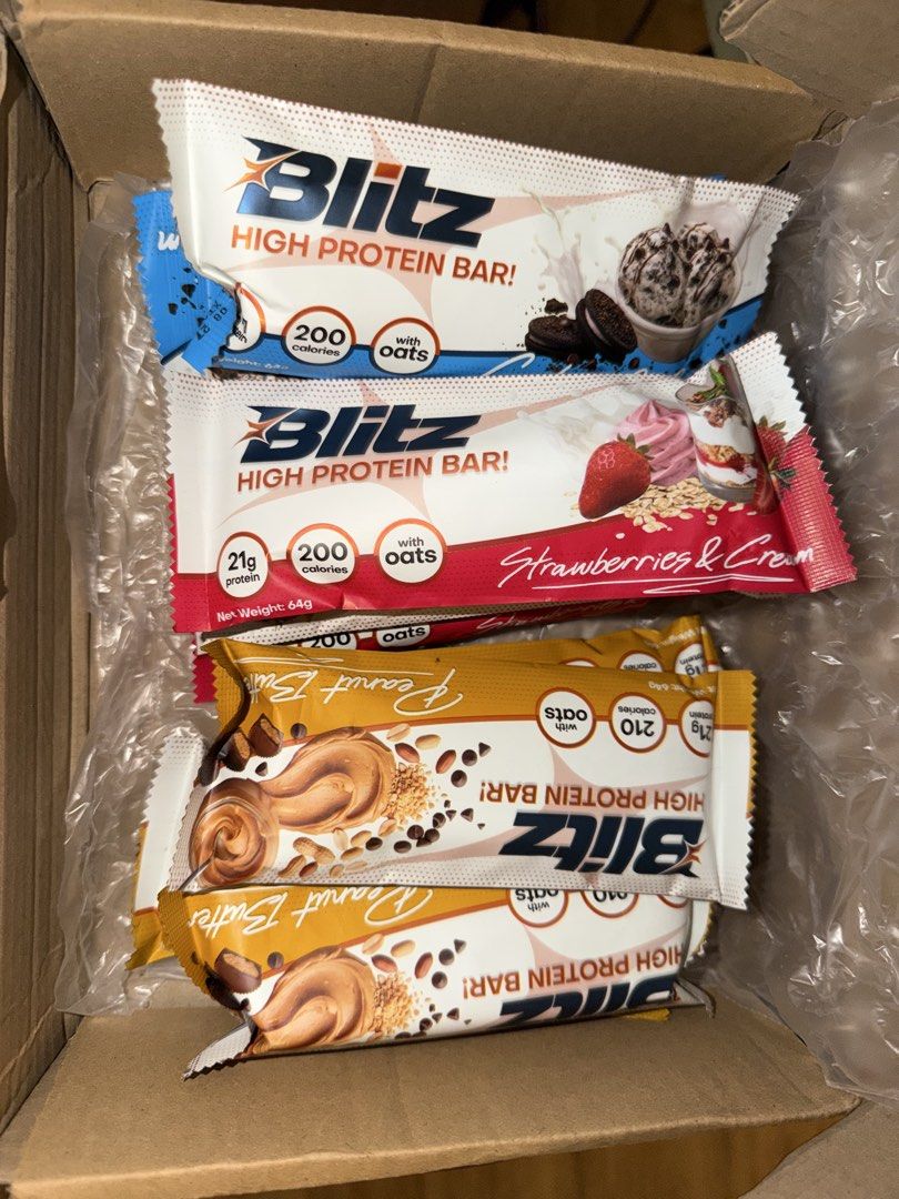 Blitz High Protein Bar Assorted Flavours (Category: Sports & Fitness Nutrition) located in Cagayan de Oro. Submitted by booksnclothes (Listing ID 1470209492, Image 2). Description: - Product: Blitz High Protein Bars Box - Flavors: Cookies & Cream, Strawberries & Cream, and Peanut Butter - Protein: 21g per bar with added oats - Weight: 64g per bar - Ideal for: Post-workout recovery or quick energy on-the-go Cookies and Cream: 3 pcs Strawberries an