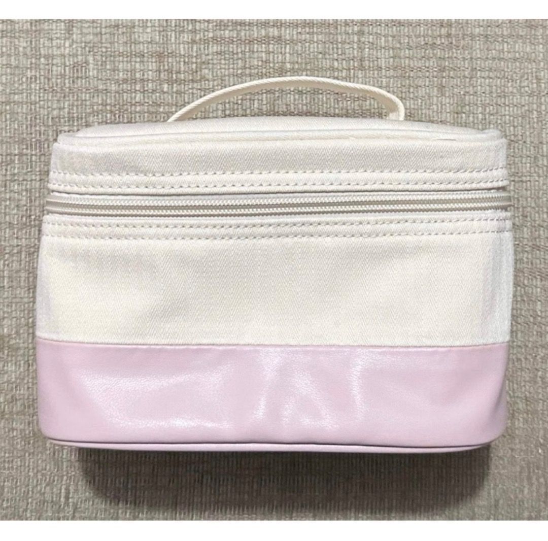 BLK Travel Kit (Category: Purses & Pouches) located in Pasig City. Submitted by shanemendozaa (Listing ID 1470344432, Image 1). Description: - Brand/Model: BLK Travel Kit vanity pouch - Design: Two-tone off-white canvas upper and pastel pink lower section - Features: Top handle for convenient carrying and custom BLK logo zipper pull - Interior: Fully lined, spacious main compartment for makeup and toiletries - Condition: Preloved, with signs of u