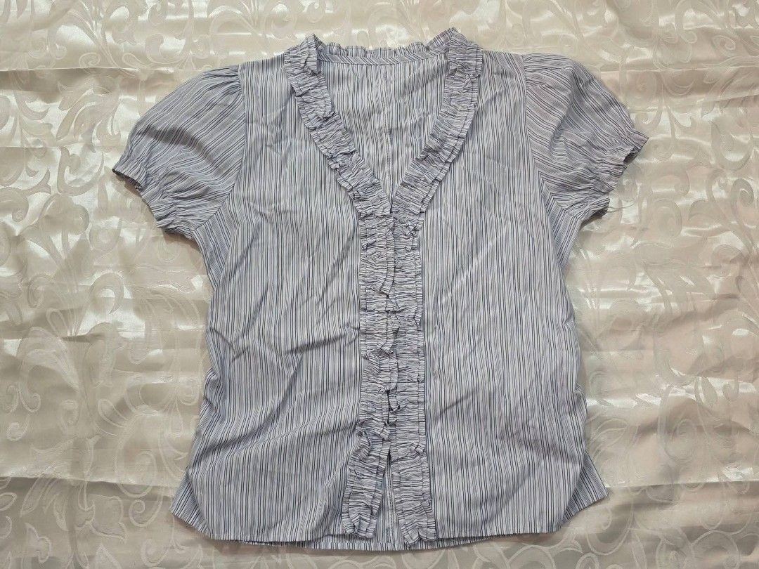 Blue & White Striped Ruffle Blouse (Category: Blouses) located in Dagupan City. Submitted by drieinpink31 (Listing ID 1470294254, Image 1). Description: 🎀 DRIÉ IN PINK ITEM DETAILS • Issue/Flaw: None 📦 SHIPPING • J&T Express • Shipping fee: Shouldered by buyer 💳 PAYMENT • GCash • Maya • COD: Not available 📌 PLEASE NOTE Any issues/flaws will be stated and shown in the listing. Please check the photos and details carefully before purchasing. 💗