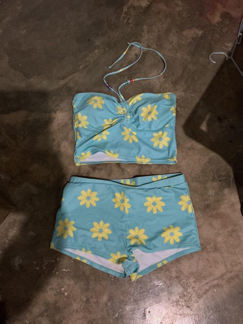 Blue Daisy Print Halter Bikini Set with Shorts (Category: Bikinis & Swimsuits) located in Santa Barbara. Submitted by user82739292 (Listing ID 1470188511, Image 1). Description: - Color & Print: Light blue with cheerful yellow daisy flowers - Top: Ruched bandeau with a stylish halter strap featuring colorful beads - Bottoms: Matching comfortable boy-shorts - Ideal for: Beach trips, pool parties, and tropical vacations - Condition: Brand new and r