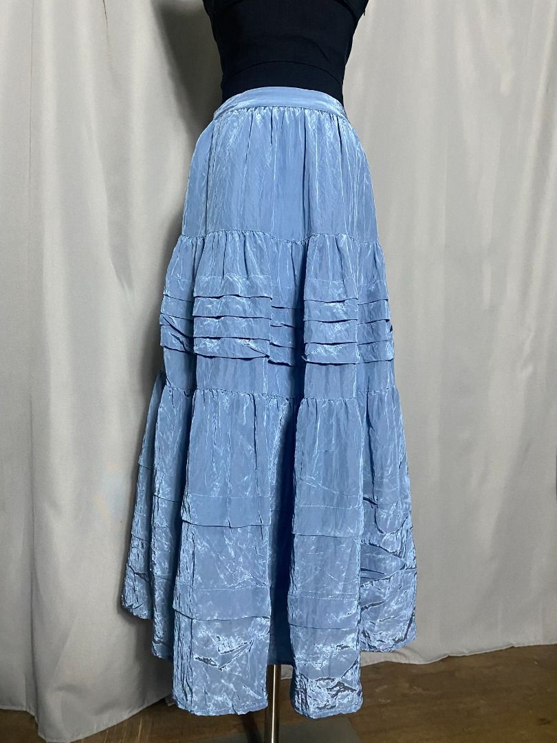 Blue iridiscent Initial tiered maxi skirt (Category: Skirts) located in Las Pinas. Submitted by ipickyou (Listing ID 1470292413, Image 3). Description: Unwashed Condition: 10/10 𝗠𝗲𝗮𝘀𝘂𝗿𝗲𝗺𝗲𝗻𝘁𝘀 𝘄𝗵𝗲𝗻 𝗹𝗮𝗶𝗱 𝗳𝗹𝗮𝘁: -Waist: 12 1/2-14” -Length: 33”.
