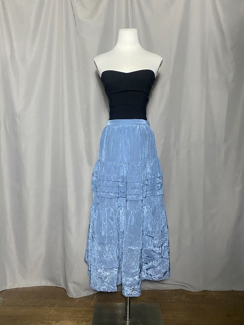Blue iridiscent Initial tiered maxi skirt (Category: Skirts) located in Las Pinas. Submitted by ipickyou (Listing ID 1470292413, Image 2). Description: Unwashed Condition: 10/10 𝗠𝗲𝗮𝘀𝘂𝗿𝗲𝗺𝗲𝗻𝘁𝘀 𝘄𝗵𝗲𝗻 𝗹𝗮𝗶𝗱 𝗳𝗹𝗮𝘁: -Waist: 12 1/2-14” -Length: 33”.