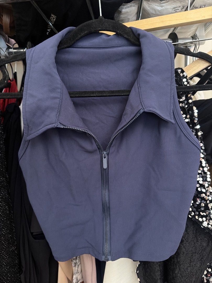 Blue Ribbed Collared Crop Top with Zip (Category: Sleeveless) located in Manila. Submitted by nicauliflower77 (Listing ID 1470171816, Image 1). Description: - Color: Blue - Material: Stretchy ribbed fabric - Fit: Slim fit, cropped length - Design: Collared neckline with full front zipper, sleeveless - Condition: Clean and well-kept - Ideal for: Casual daily wear or workouts.