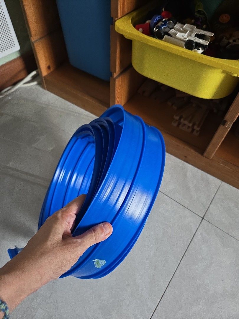 Blue Toy Car flexible Track Roll (Category: Kids Toys) located in Pasig City. Submitted by izzy0202 (Listing ID 1470147045, Image 2). Description: - Type: Flexible toy car track - Color: Bright blue with a small logo sticker - Feature: Long roll that coils up easily for compact storage - Fun factor: Great for creating custom race tracks all over the room.