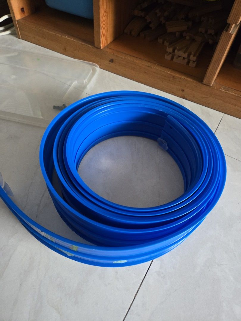 Blue Toy Car flexible Track Roll (Category: Kids Toys) located in Pasig City. Submitted by izzy0202 (Listing ID 1470147045, Image 1). Description: - Type: Flexible toy car track - Color: Bright blue with a small logo sticker - Feature: Long roll that coils up easily for compact storage - Fun factor: Great for creating custom race tracks all over the room.
