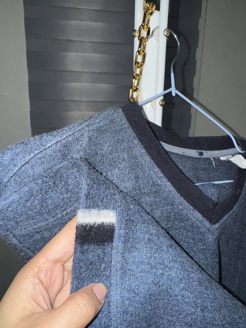 Blue V-Neck Cotton Blend Sweater (Category: Longsleeves) located in La Trinidad. Submitted by prelovedandfindsbyji (Listing ID 1470285029, Image 3). Description: - Color & Style: Blue knit sweater with a contrasting dark V-neck and stylish striped accents on the upper sleeves - Size: L/G (16-18) with a comfortable, relaxed fit ideal for cooler weather - Material: Premium blend of 58% cotton and 42% acrylic - Care: Easy to wash and maintain - Orig