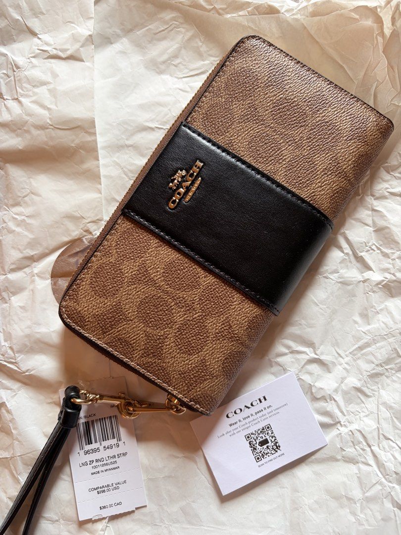 BNWT Coach Zip Around Wallet Tan Black (Category: Wallets & Card holders) located in Batangas. Submitted by aylabtoshop (Listing ID 1470185821, Image 1). Description: 💵 ₱5,000 only | or your best offer BNWT Coach long zip wallet with removable strap. 100% 0rig complete with tag & care card. Purchased in Hawaii 📍 Lipa City, Batangas SHIP AGAD via J&T.