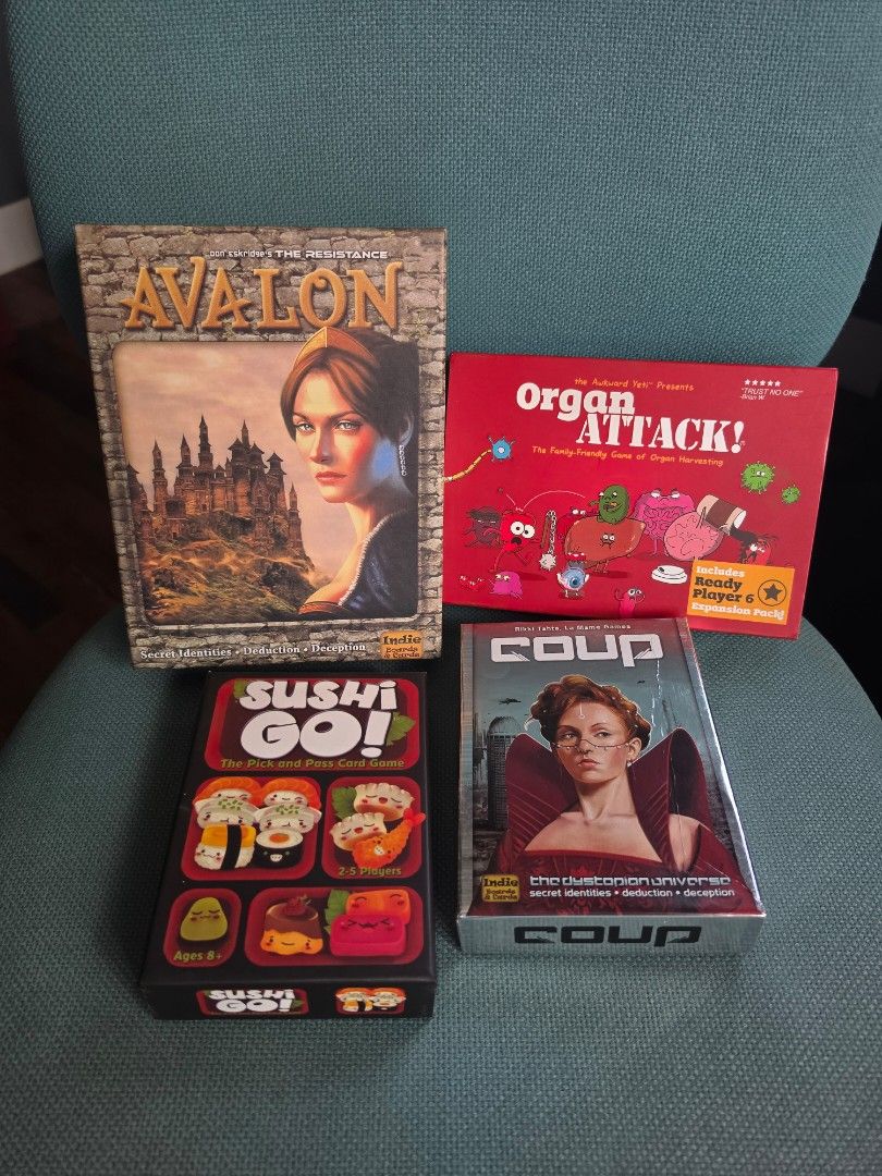 Board games bundle - Avalon, Coup, Organ Attack, Sushi Go (Category: Board Games & Puzzles) located in Paranaque City. Submitted by bluegreen689 (Listing ID 1470148378, Image 1). Description: - 4-in-1 Board Game Bundle: Includes Avalon The Resistance, Coup (with token bag), Organ Attack (with Ready Player 6 expansion), and Sushi Go. - Protected Cards: All cards in Coup, Avalon and Organ Attack are kept inside plastic sleeves to prevent wear and t