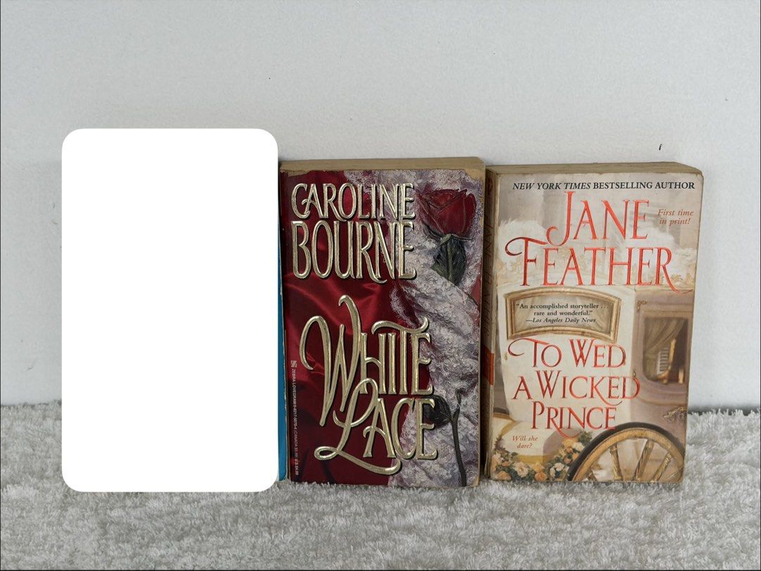 Bodice Ripper Book Duo (Category: Storybooks) located in Naga. Submitted by klutzdeclutters (Listing ID 1470277763, Image 1). Description: Includes: - White Lace by Caroline Bourne - To Wed a Wicked Prince by Jane Feather Condition: - Covers and spines are of excellent condition. Minimal shelf wear or faint edge creasing. - Pages are clean, crisp, fully legible, and intact. No missing pages or dog-ears. - Completely clean text and no highlighting