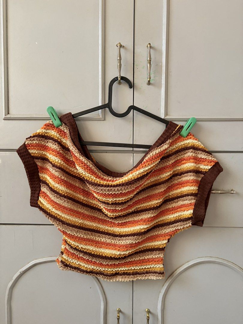 Boho One shoulder top (Category: Blouses) located in Manila. Submitted by racajamess (Listing ID 1470263949, Image 1). Description: - Style: Retro off-shoulder crop top with cap sleeves - Colors: Warm autumn palette (brown, orange, yellow, and cream horizontal stripes) - Material: Comfortable textured knit fabric - Fit: Snug fit, ideal for pairing with high-waisted denim - Condition/Vibe: Great vintage everyday wear.