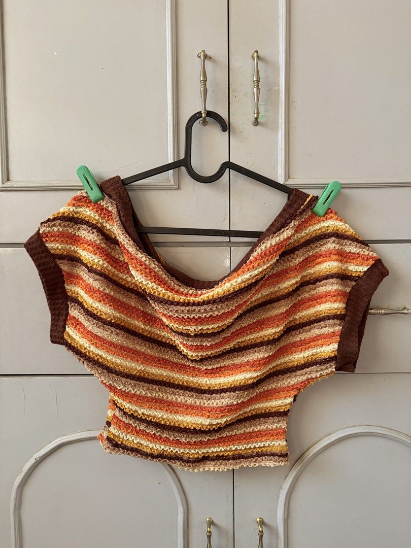 Boho One shoulder top (Category: Blouses) located in Manila. Submitted by racajamess (Listing ID 1470263949, Image 2). Description: - Style: Retro off-shoulder crop top with cap sleeves - Colors: Warm autumn palette (brown, orange, yellow, and cream horizontal stripes) - Material: Comfortable textured knit fabric - Fit: Snug fit, ideal for pairing with high-waisted denim - Condition/Vibe: Great vintage everyday wear.