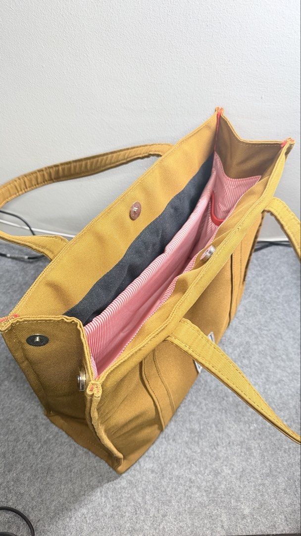 Book Tote Laptop Work Bag (Category: Tote Bags) located in Quezon City. Submitted by mythriftdeals (Listing ID 1470262776, Image 3). Description: Used only twice. RFS: decluttering Dimensions: 30cm x 37cm x 12cm Material: High quality Polyester Canvas fabric Shockproof compartment: Fits 13-14” laptop Small compartments inside 📍Cubao, QC.
