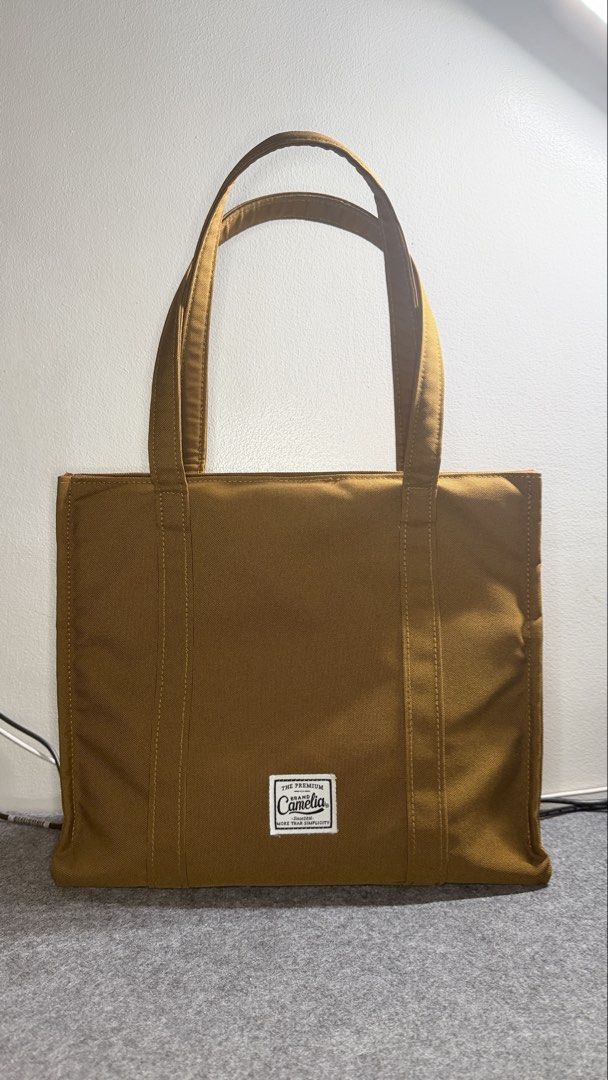 Book Tote Laptop Work Bag (Category: Tote Bags) located in Quezon City. Submitted by mythriftdeals (Listing ID 1470262776, Image 1). Description: Used only twice. RFS: decluttering Dimensions: 30cm x 37cm x 12cm Material: High quality Polyester Canvas fabric Shockproof compartment: Fits 13-14” laptop Small compartments inside 📍Cubao, QC.