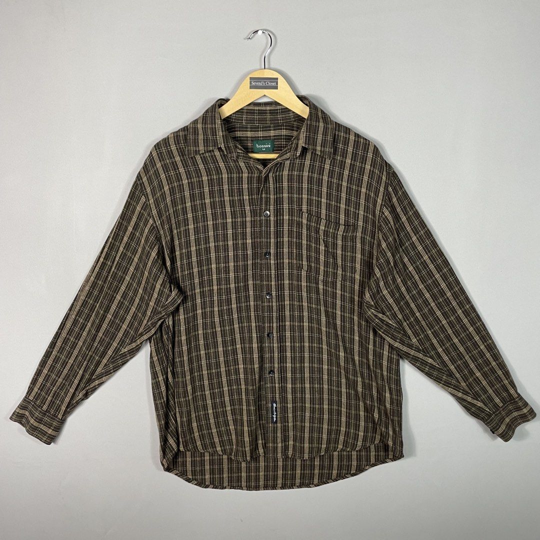 Bossini | Dark Brown Patterned Plaid Checkered Flannel (Category: Tshirts & Polo Shirts ) located in Norzagaray. Submitted by sevenjscloset (Listing ID 1470254062, Image 1). Description: - Brand: Bossini - Style: Dark brown plaid flannel shirt - Size: Medium (Length: 27", Width: 20") - Fit reference: Model is 5'10" and 70kg - Features: Classic checkered pattern, front button closure, chest pocket - Condition: Great vintage piece, no flaws.