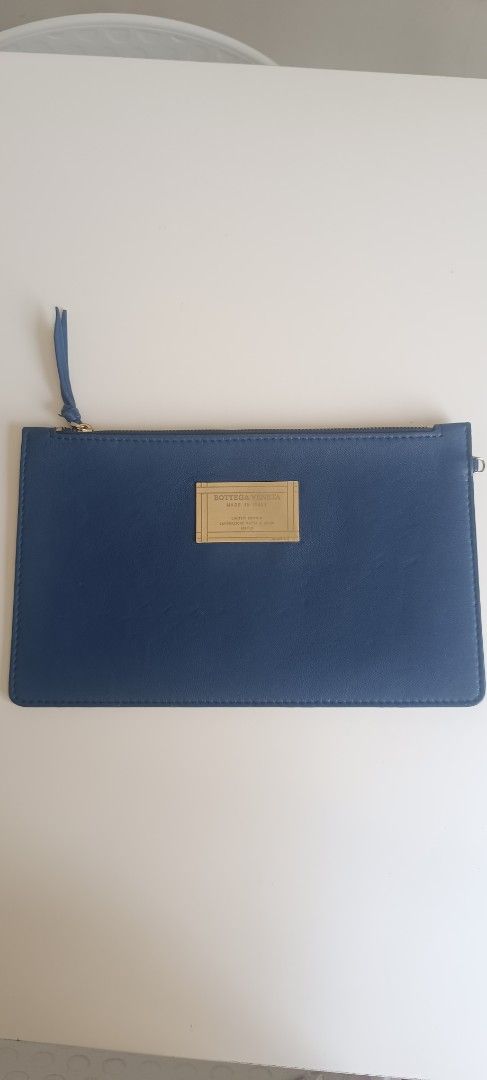 Bottega Veneta Blue Leather Zip Pouch (Category: Luxury Bags & Wallets) located in Subic. Submitted by prelovedwithloveph2019 (Listing ID 1470179629, Image 1). Description: - Brand: Bottega Veneta - Material: Cabat blue leather with brown interior lining - Hardware: Gold-tone front plaque with engraved lettering - Closure: Secure zip closure with a leather pull tab - Design: Clean, simple, and practical for carrying daily essentials - Condition: 