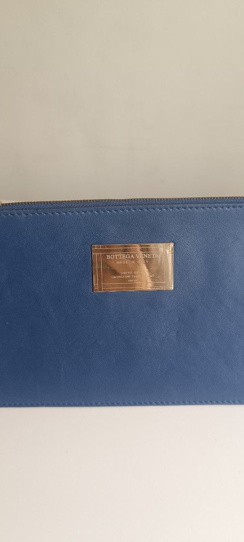 Bottega Veneta Blue Leather Zip Pouch (Category: Luxury Bags & Wallets) located in Subic. Submitted by prelovedwithloveph2019 (Listing ID 1470179629, Image 2). Description: - Brand: Bottega Veneta - Material: Cabat blue leather with brown interior lining - Hardware: Gold-tone front plaque with engraved lettering - Closure: Secure zip closure with a leather pull tab - Design: Clean, simple, and practical for carrying daily essentials - Condition: 