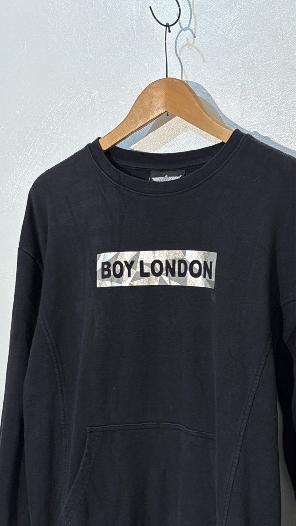Boy London Black and Silver Pullover Sweatshirt Size S (Category: Coats, Jackets and Outerwear) located in Manila. Submitted by glano (Listing ID 1470299189, Image 2). Description: - Brand: Boy London - Color: Black - Size: Small - Design: Silver reflective box logo (front) and large eagle graphic (back) - Features: Front pouch pocket - Material: Warm and comfortable cotton - Style: Classic streetwear piece - Condition: Excellent, ready to wear.