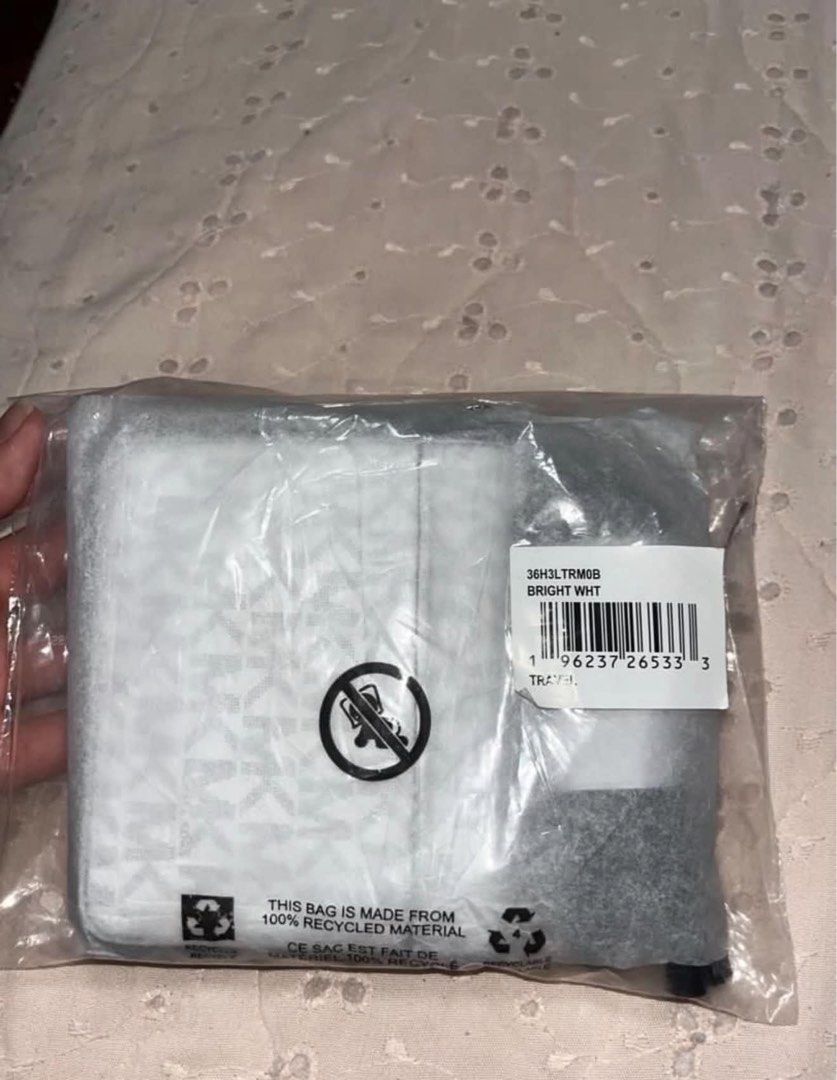 Brand New Michael Kors White Monogram Wallet (Category: Wallets & Card holders) located in Las Pinas. Submitted by basicapparel_mnl (Listing ID 1470272385, Image 3). Description: Brand New Michael Kors Wallet with Sling RFS: unwanted gift (srp 9k).