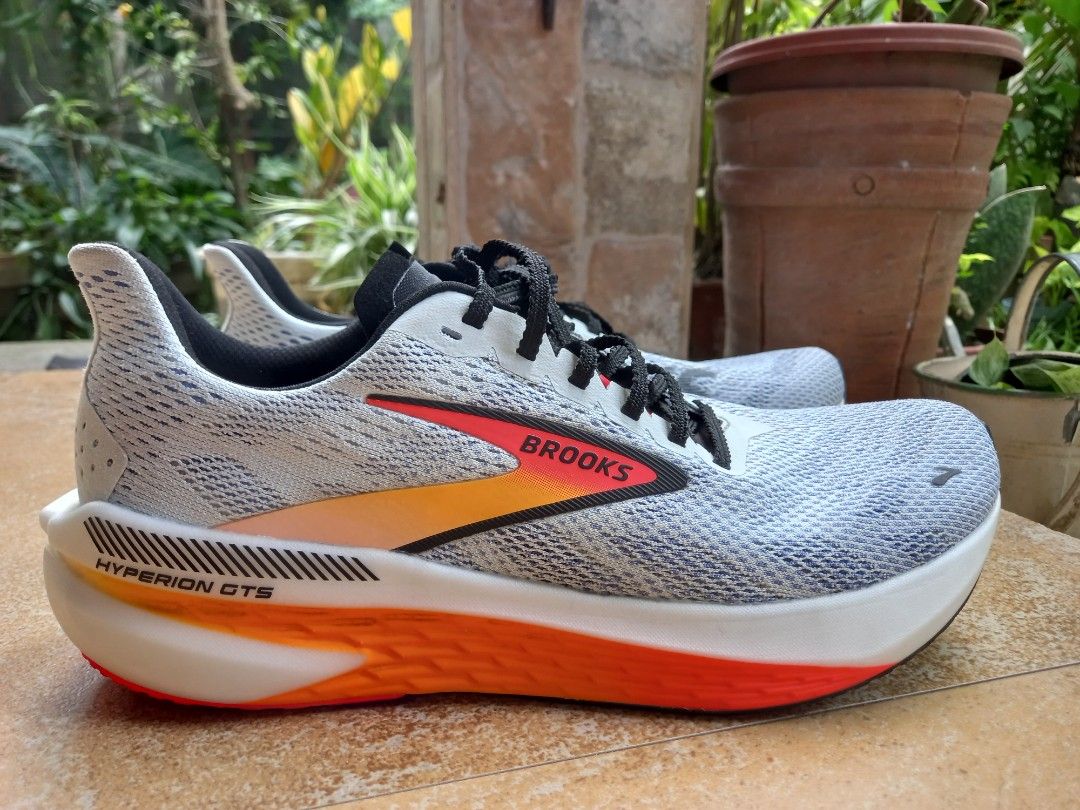 Brooks Hyperion GTS Running Shoes (Category: Sneakers) located in Davao. Submitted by kirk214red-50020 (Listing ID 1470217014, Image 3). Description: - Brand: Brooks Hyperion GTS Performance Running Shoes - Colorway: White with striking orange and red gradient midsoles and black laces - Cushioning: DNA FLASH nitrogen-infused tech for lightweight responsiveness - Upper: Breathable engineered mesh with supportive Go To Support side stripes - Condit