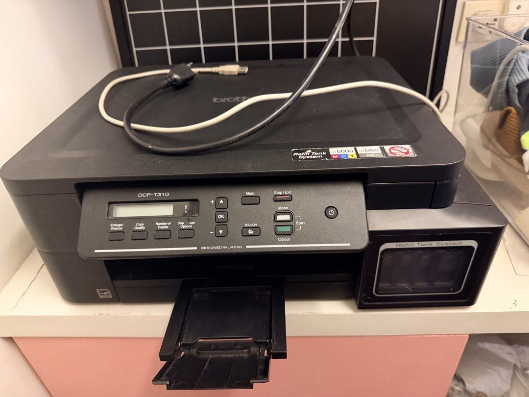 Brother DCP T310 (Category: Printers, Scanners & Copiers) located in Malabon City. Submitted by zzz_97 (Listing ID 1470194635, Image 2). Description: Brand: Brother * Model: DCP-T310 * Functions: Print, scan, and copy * Printing: Black-and-white and color * Ink System: Refillable ink tanks * Print Speed: Up to 12 ipm (monochrome) and 6 ipm (color) * Print Resolution: Up to 1,200 x 6,000 dpi (Windows) * Page Yield: Up to 6,500 pages for black ink 