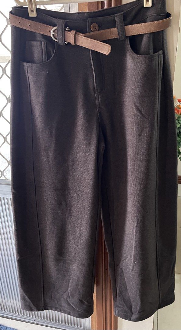 Brown pants (Category: Jeans) located in Bacoor. Submitted by ayit. (Listing ID 1470171048, Image 1). Description: Bnew orig japan Sf inc - Color: Dark brown - Fit: High waist with a long, straight wide-leg cut - Details: Front center button closure, front pockets, and back patch pockets - Bonus: Includes a matching tan leather belt with a silver-tone buckle - Styling: Easy to mix and match for casual or smart casual outfits.
