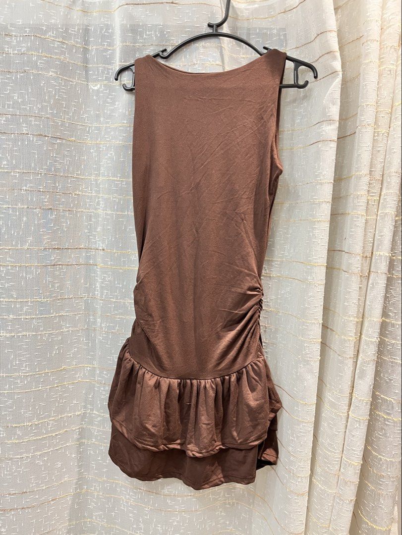 Brown Ruched Ruffle Mini Dress (Category: Dresses) located in Manila. Submitted by declutwtlu_ (Listing ID 1470288665, Image 1). Description: - Bought it for ₱230 with shipping - Size: XS-S - Details: Double-layered ruffled hem - Fit: Stretchy, body-hugging, and super flattering - Condition: Worn only once.