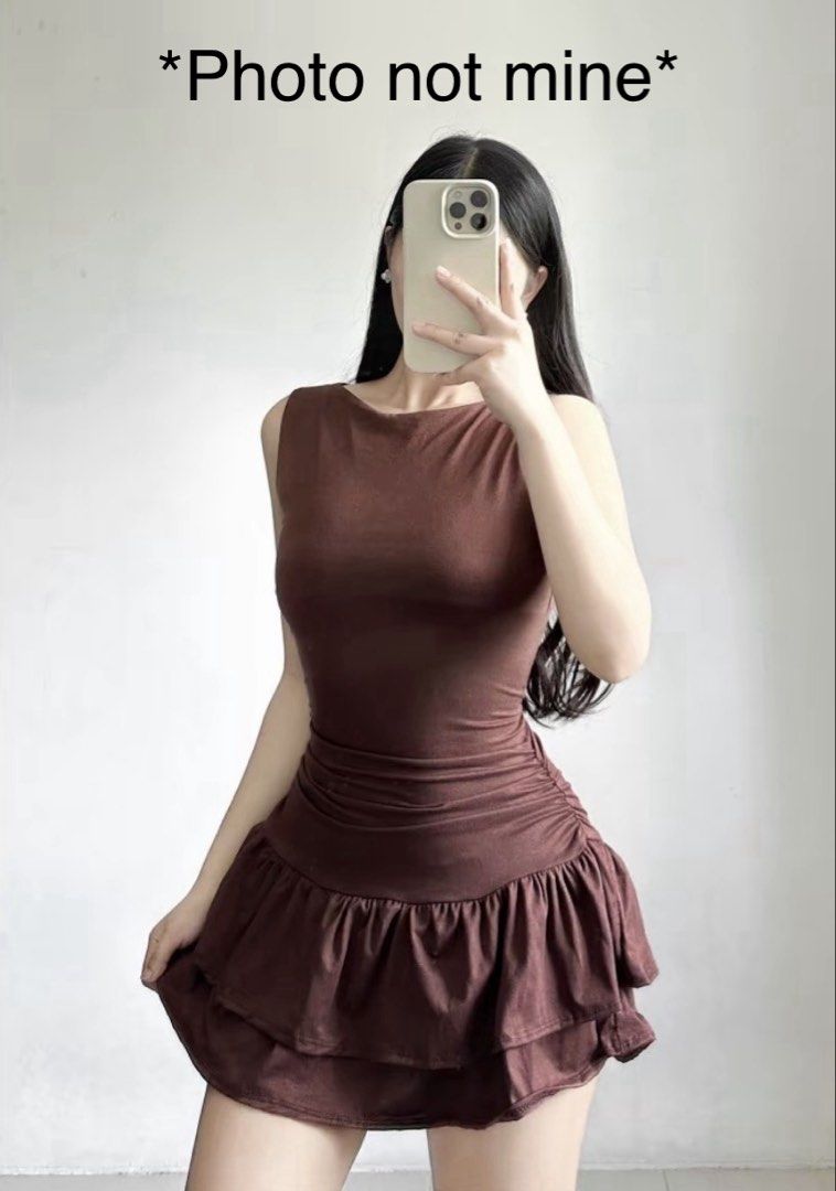 Brown Ruched Ruffle Mini Dress (Category: Dresses) located in Manila. Submitted by declutwtlu_ (Listing ID 1470288665, Image 2). Description: - Bought it for ₱230 with shipping - Size: XS-S - Details: Double-layered ruffled hem - Fit: Stretchy, body-hugging, and super flattering - Condition: Worn only once.