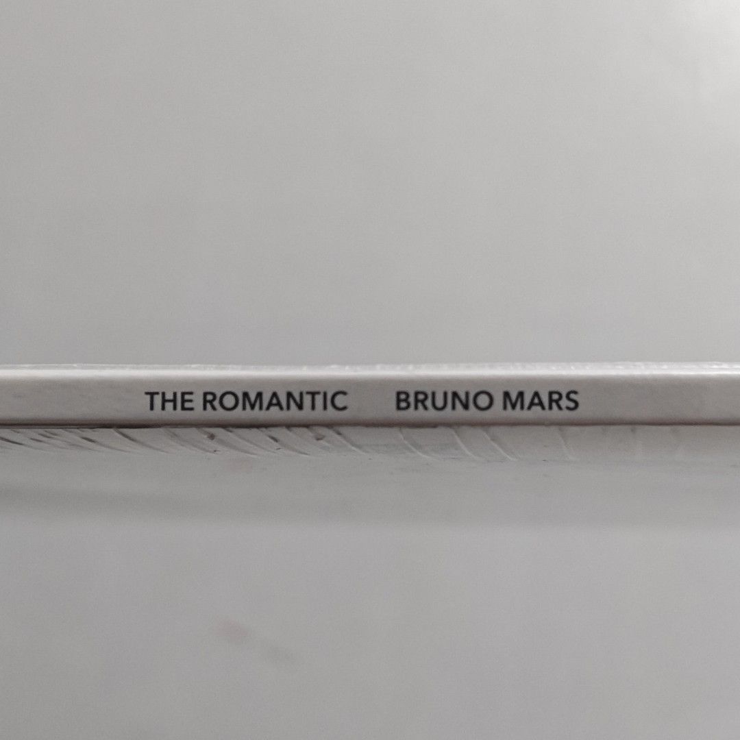 Bruno Mars The Romantic Vinyl Record (Numbered/Limited Edition) (Category: Vinyls) located in Makati City. Submitted by prinsguessallgone (Listing ID 1470293693, Image 3). Description: - Artist & Album: Bruno Mars - The Romantic - Format: Vinyl LP (Made in Poland, Atlantic Records) - Rarity: Hand-numbered limited edition, #11442 out of 25,000 - Cover Art: Black and white illustrated portrait framed by roses and chains - Tracklist: Risk It All, Ch