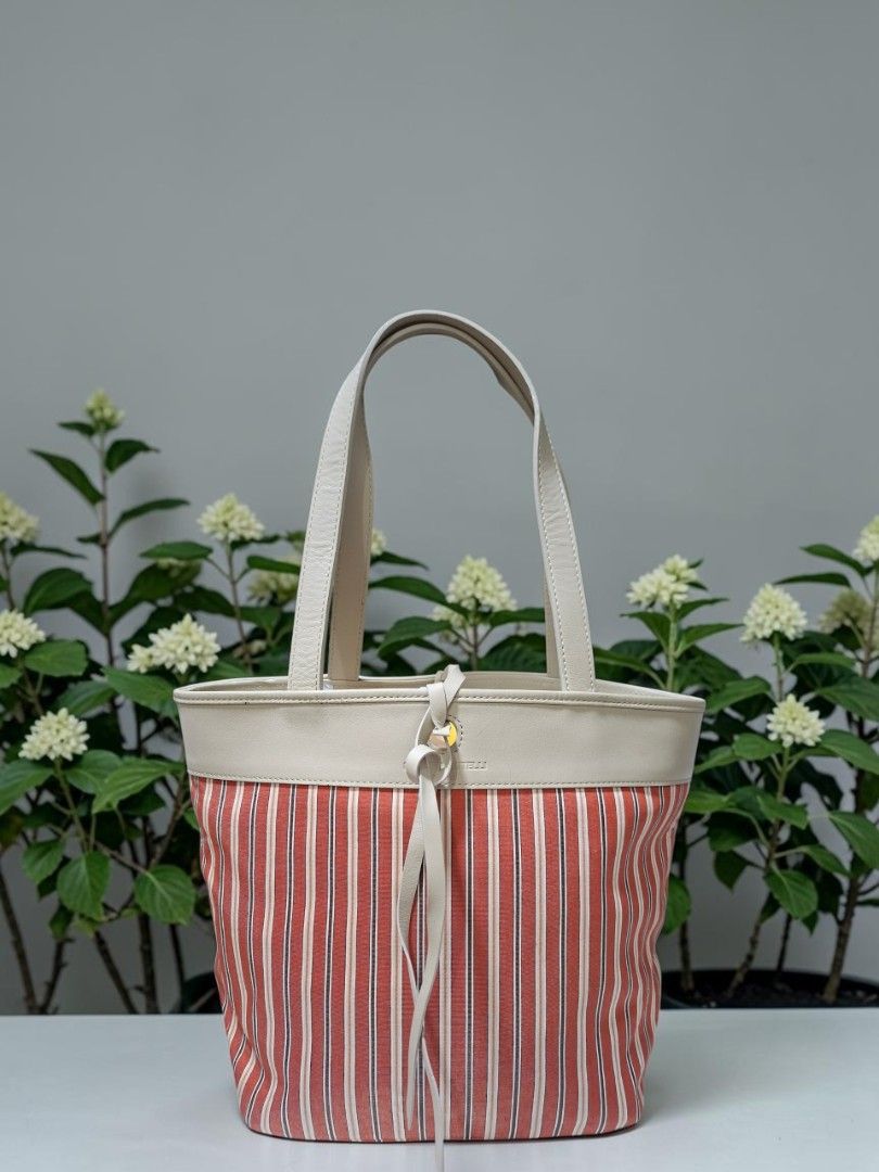 BRUNO PIATTELLI ROMA STRIPES TOTE (Category: Tote Bags) located in Las Pinas. Submitted by annachiaonair2037 (Listing ID 1470306832, Image 2). Description: BRUNO PIATTELLI ROMA STRIPES NYLON TOTE WITH GENUINE LEATHER TRIMMINGS FROM JAPAN YKK ZIP OPEN TOTE WITH SELF TIE LEATHER STRING H 9.5" L 8" W 6.5" Disclaimer: I am not affiliated with, associated with, or authorized by any of the brands featured posted. Any mention of brand names, trademarks,