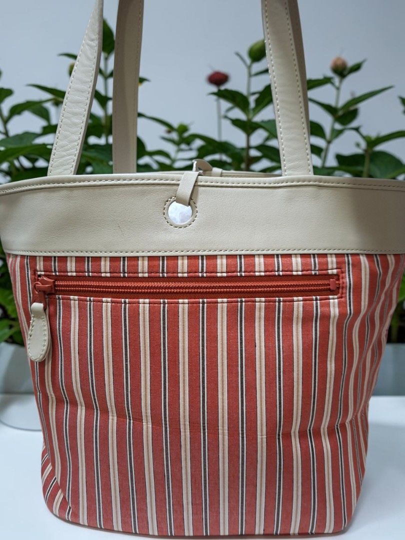 BRUNO PIATTELLI ROMA STRIPES TOTE (Category: Tote Bags) located in Las Pinas. Submitted by annachiaonair2037 (Listing ID 1470306832, Image 3). Description: BRUNO PIATTELLI ROMA STRIPES NYLON TOTE WITH GENUINE LEATHER TRIMMINGS FROM JAPAN YKK ZIP OPEN TOTE WITH SELF TIE LEATHER STRING H 9.5" L 8" W 6.5" Disclaimer: I am not affiliated with, associated with, or authorized by any of the brands featured posted. Any mention of brand names, trademarks,