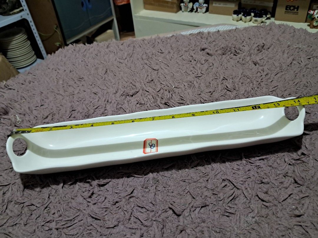 Buffet cuddy (Category: Dinnerware & Cutlery) located in Cavite. Submitted by secretjapansurplus (Listing ID 1470248496, Image 3). Description: 50 pesos each 12 pcs available Vintage Porcelain Buffet Flatware Caddy Description: This is an elegant, vintage-style white porcelain buffet flatware caddy, explicitly designed to organize and beautifully present silverware (forks, knives, or spoons) on a banquet table or buffet line. It features a sleek,