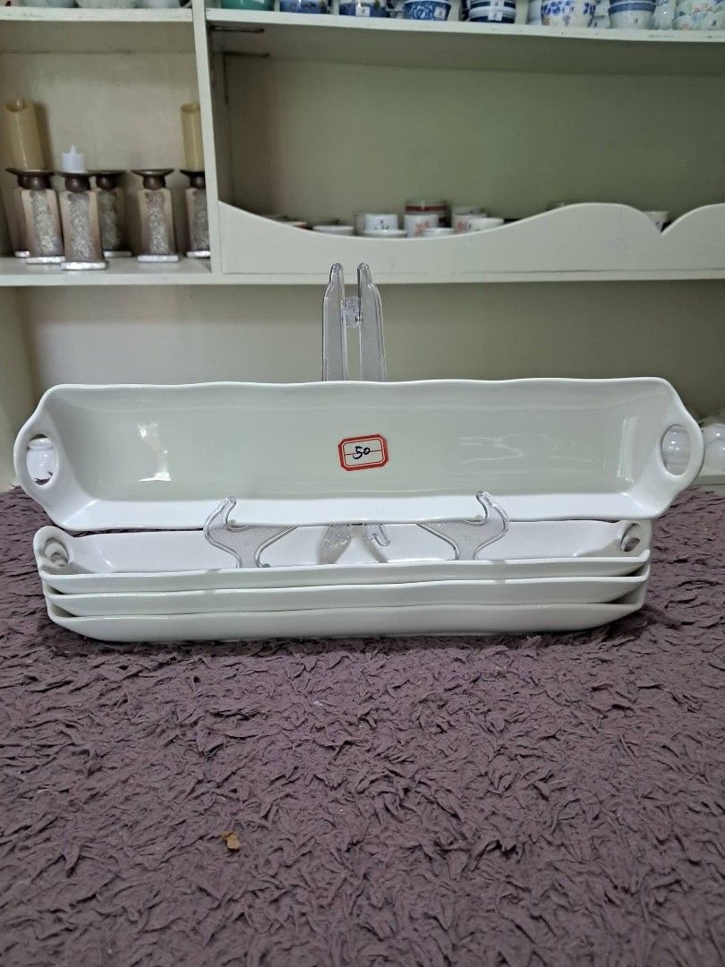 Buffet cuddy (Category: Dinnerware & Cutlery) located in Cavite. Submitted by secretjapansurplus (Listing ID 1470248496, Image 1). Description: 50 pesos each 12 pcs available Vintage Porcelain Buffet Flatware Caddy Description: This is an elegant, vintage-style white porcelain buffet flatware caddy, explicitly designed to organize and beautifully present silverware (forks, knives, or spoons) on a banquet table or buffet line. It features a sleek,