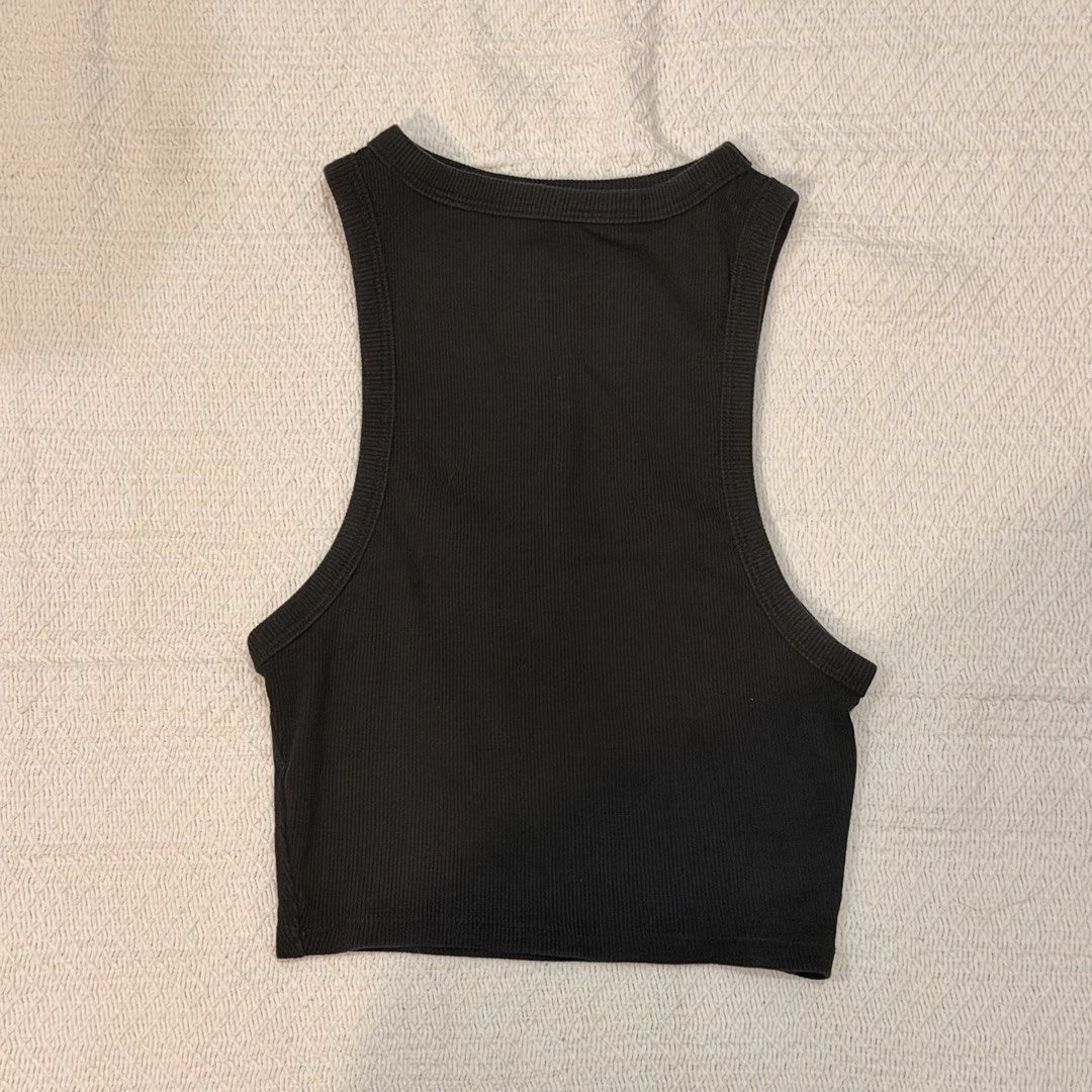 Bundle of 4 black tops and tanks (Category: Sleeveless) located in Makati City. Submitted by banshee1411 (Listing ID 1470253452, Image 3). Description: Bundle of 4 essential black tops - ribbed mock neck sleeveless top - racerback crop top - camisole with criss-cross back straps - ruched spaghetti strap top .