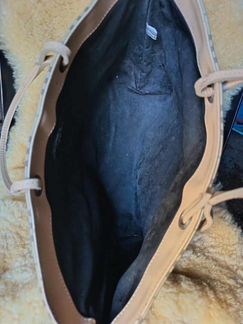 Burberry (Category: Luxury Bags & Wallets) located in Aroroy. Submitted by vin2za06 (Listing ID 1470348497, Image 3). Description: This is a Burberry London Nova Check Tote Bag, an iconic Y2K-era open-top shopper featuring a yellow-toned canvas backdrop, brown intersecting bands, and a thin green accent stripe. It is accented with light beige/tan leather top handles and silver-tone hardware grommets..