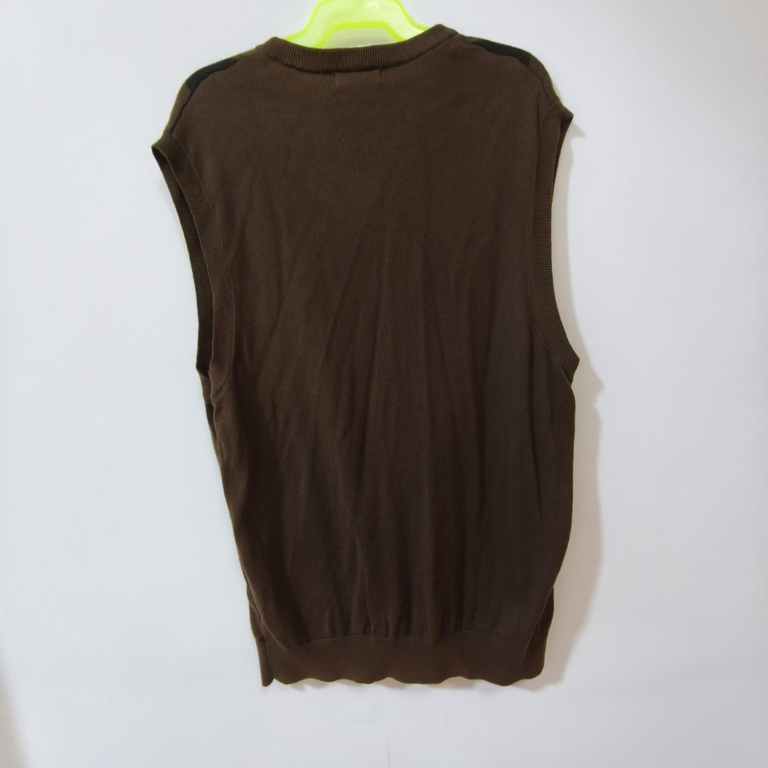Burberry Black Label Argyle Knit Vest Brown Size 3 (Category: Vests) located in Quezon City. Submitted by inrelationthrift (Listing ID 1470192001, Image 2). Description: - Brand: Burberry Black Label - Style: Sleeveless knit vest / V-neck - Color: Brown tones with classic front argyle pattern and solid back - Details: Ribbed hem and arm openings, signature embroidered Equestrian Knight logo near the bottom - Perfect for smart-casual layering - Me