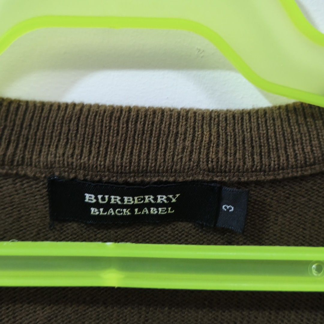 Burberry Black Label Argyle Knit Vest Brown Size 3 (Category: Vests) located in Quezon City. Submitted by inrelationthrift (Listing ID 1470192001, Image 3). Description: - Brand: Burberry Black Label - Style: Sleeveless knit vest / V-neck - Color: Brown tones with classic front argyle pattern and solid back - Details: Ribbed hem and arm openings, signature embroidered Equestrian Knight logo near the bottom - Perfect for smart-casual layering - Me