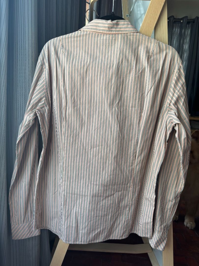 Burberry Blue Label Long Sleeve Striped Button Down Shirt Large (Category: Formal Shirts) located in Cebu City. Submitted by _t.rix (Listing ID 1470199033, Image 2). Description: - Brand: Burberry Blue Label - Size: L (based on interior tag) - Design: Multicolor striped pattern (peach, black, and white tones) - Details: Classic collar, front button closure, two button-flap chest pockets - Branding: Small embroidered equestrian knight logo on left