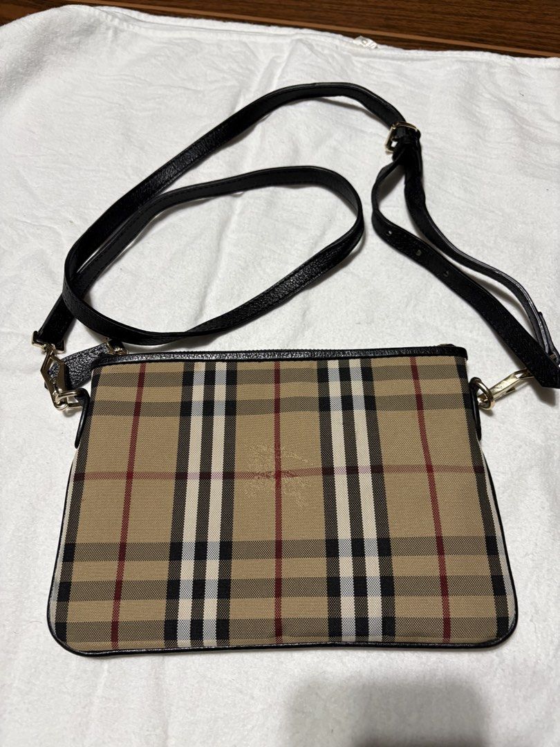 Burberry Check Crossbody Bag (Category: Luxury Bags & Wallets) located in Bulacan. Submitted by love2loved (Listing ID 1470275990, Image 2). Description: - Burberry crossbody bag in iconic check pattern - Stylish black leather trim with premium gold-tone hardware - Secure top zip closure for everyday peace of mind - Comfortable, adjustable leather strap for custom fit - Clean canvas exterior and spacious enough for daily essentials - Versatile de