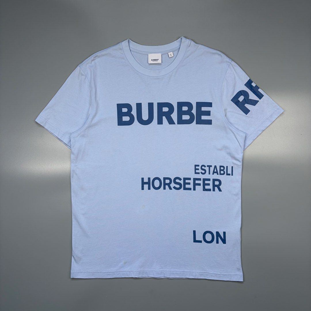 Burberry Horseferry (Authentic) (Category: Luxury Apparel) located in Cavite. Submitted by onebeancent (Listing ID 1470344854, Image 1). Description: Size: Large (Men) | XL to XXL (Women's) Dimension: 21" Width | 27" Length Color: Pale Blue Color Rate: 10/10 Issue: None Condition: Like new‼️ Price: 1,380php Additional Shipping Fee (J&T Small Pouch) 75php Luzon 100php visayas 120php mindanao.