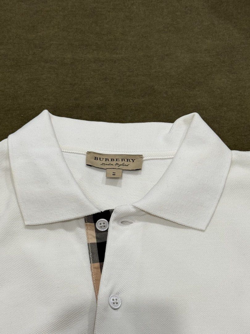 BURBERRY POLO SHIRT (Category: Tshirts & Polo Shirts ) located in Davao. Submitted by goodnightinego (Listing ID 1470311635, Image 2). Description: Burberry White Polo Shirt M on Tag 20w x 27L Excellent Condition .