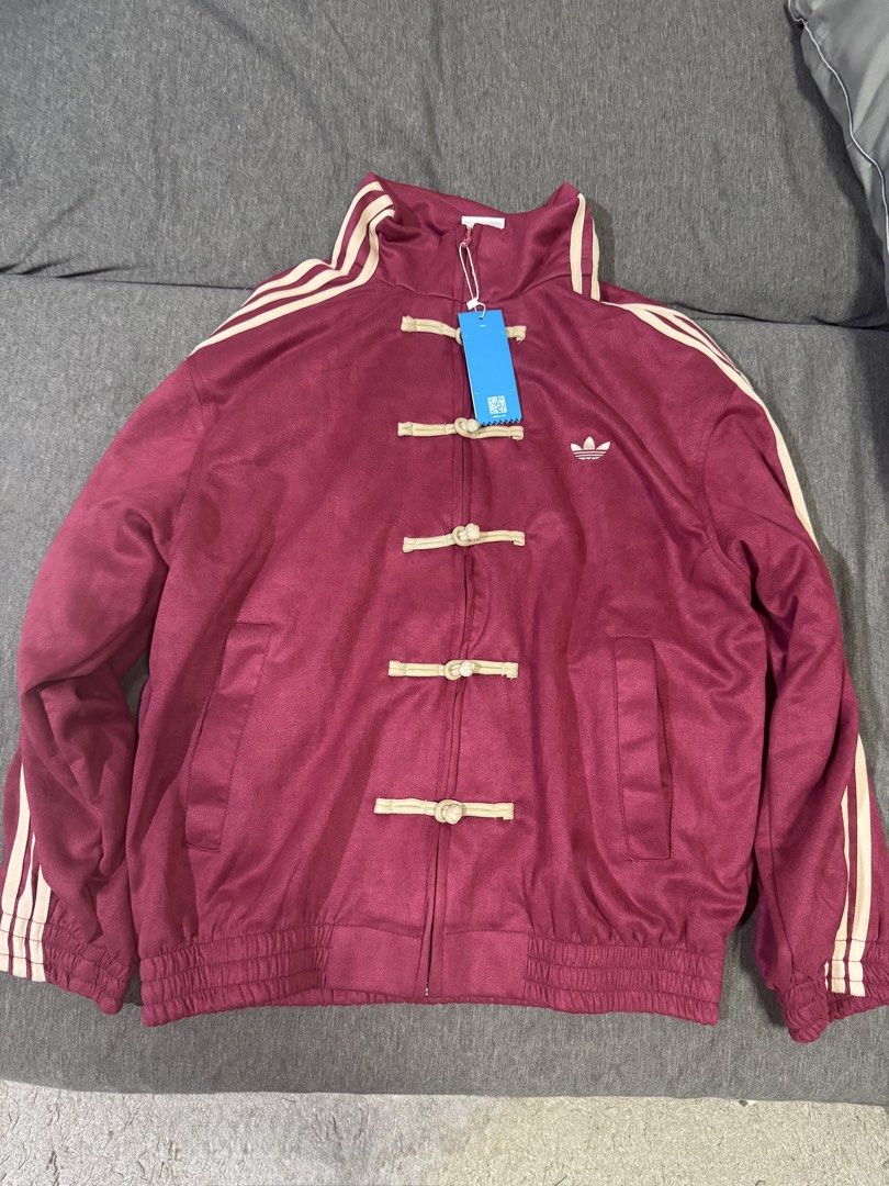 Burgundy Chinese New Year Jacket (Category: Coats, Jackets and Outerwear) located in Manila. Submitted by nothingandeverything (Listing ID 1470285823, Image 1). Description: - From Shanghai, China - Style: Chinese New Year Jacket - Details: Embroidered trefoil logo on the chest and high collar - Condition: Brand new with tags (BNWT), never worn - Origin: Made in Pakistan - Unisex - Negotiable.