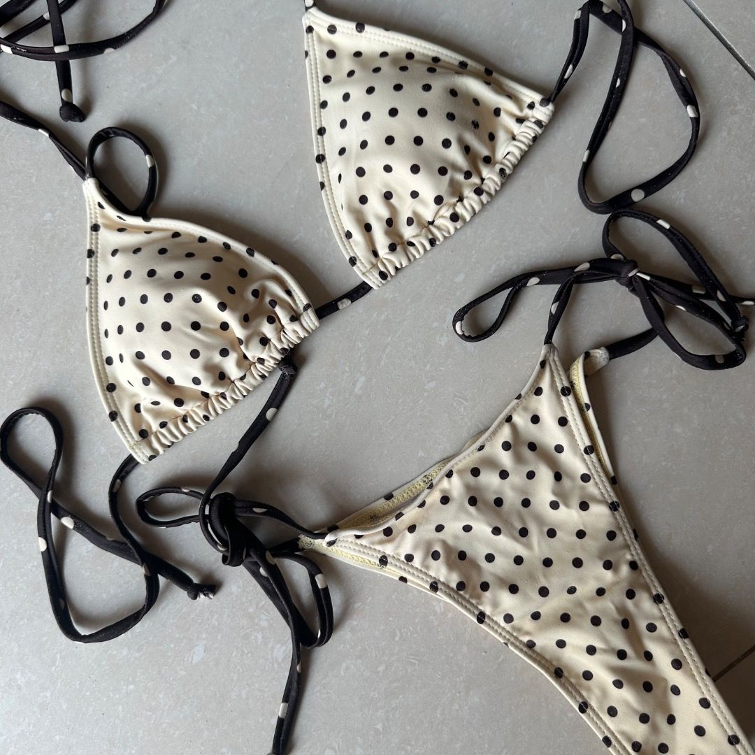 Butter Yellow and Dark Brown Polka Dot Bikini (Category: Bikinis & Swimsuits) located in Paranaque City. Submitted by yanie.ae (Listing ID 1470166613, Image 1). Description: - Top: Triangle style with adjustable neck and back ties - Bottoms: Matching style with adjustable side ties for a custom fit - Occasion: Ideal for the beach, pool parties, or vacations - Condition: Brand new, high quality.