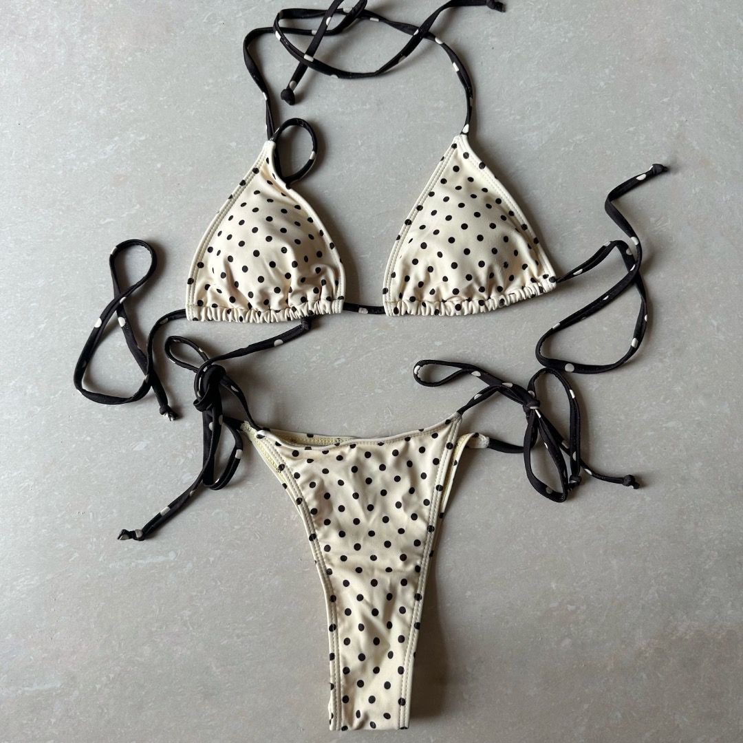 Butter Yellow and Dark Brown Polka Dot Bikini (Category: Bikinis & Swimsuits) located in Paranaque City. Submitted by yanie.ae (Listing ID 1470166613, Image 2). Description: - Top: Triangle style with adjustable neck and back ties - Bottoms: Matching style with adjustable side ties for a custom fit - Occasion: Ideal for the beach, pool parties, or vacations - Condition: Brand new, high quality.