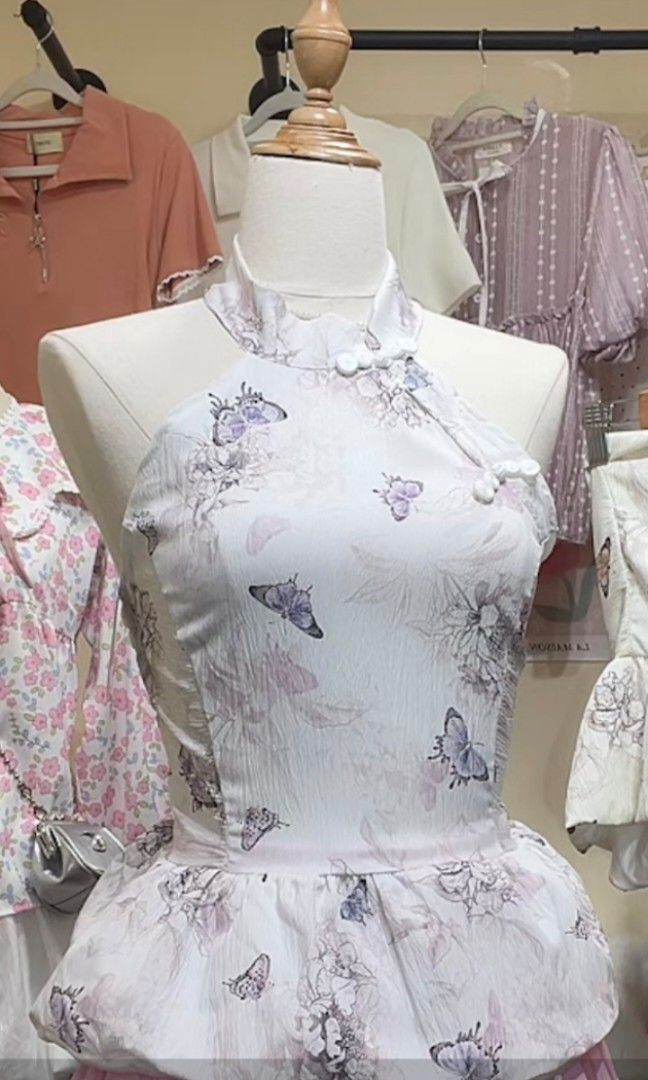 Butterfly Floral Smocked Halter Top (Category: Sleeveless) located in Manila. Submitted by preloved_tweeds_ph (Listing ID 1462615820, Image 1). Description: small to medium loc: pampanga - White halter top - Pretty butterfly and floral print - Smocked back for a comfortable fit - Straps tie at the neck - Textured fabric - Ideal for casual outings or beach trips.
