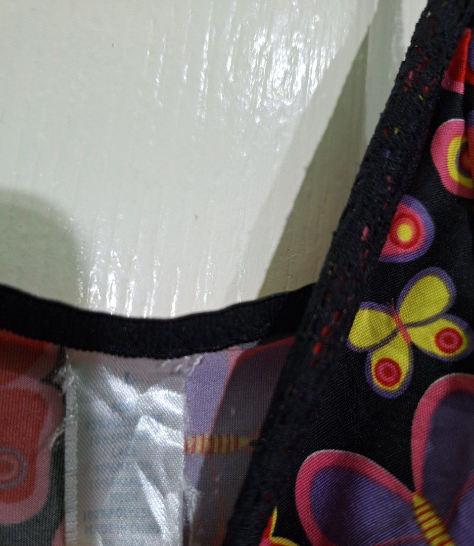 Butterfly pattern lingerie dress medium D12 (Category: Undergarments & Loungewear) located in San Pablo. Submitted by allyourbrandedneeds (Listing ID 1470145005, Image 3). Description: - Design: All-over colorful butterfly pattern on a black base - Neckline: V-neck with delicate black lace trim - Straps: Adjustable shoulder straps for a custom fit - Details: Cute pink ruffled ribbon accent on the chest - Hem: Sheer dotted mesh ruffle layer - Cond