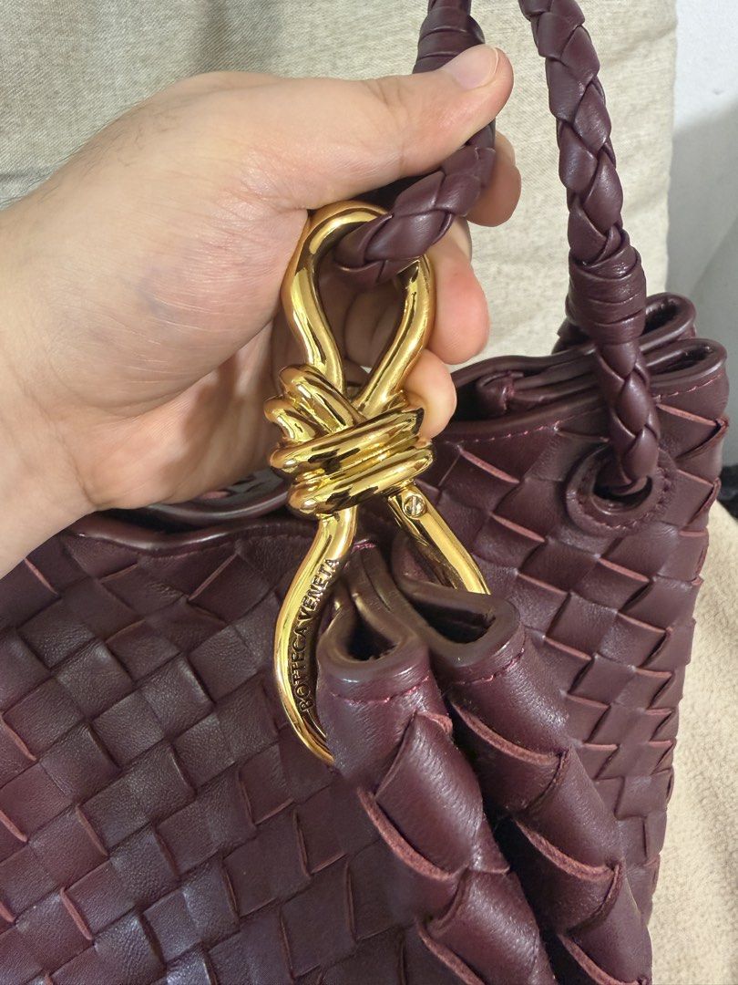 BV Parachute Intrecciato Large (Category: Shoulder Bags) located in Makati City. Submitted by empiricalluxe (Listing ID 1470176186, Image 2). Description: Barolo (burgundy/wine red) with gold hardware With dust bag 📍Legazpi Village, Makati I’m on the nightshift so replies may be slow during the daytime Buyers will be responsible for booking and paying for same-day delivery service For buyers in Metro Manila and nearby areas only that are service