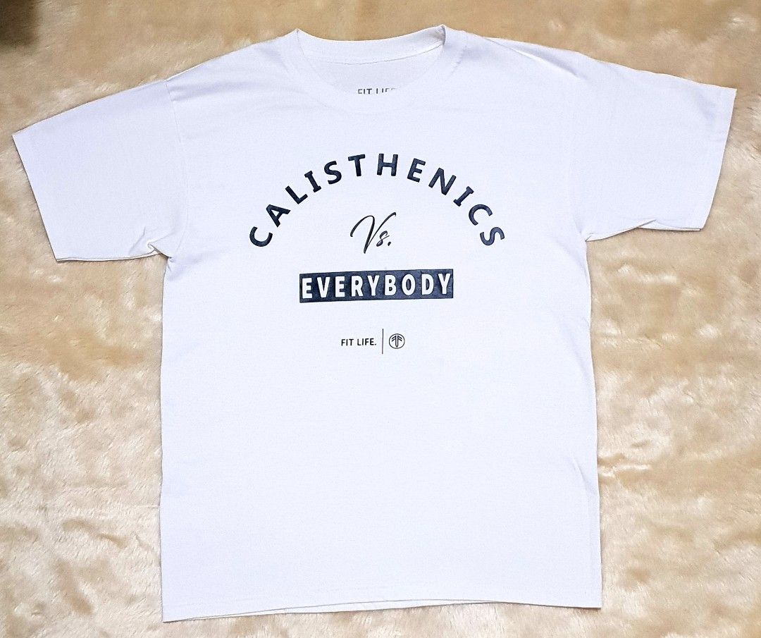 Calisthenics Vs. Everybody (Category: Tshirts & Polo Shirts ) located in Taguig. Submitted by wethrifting2021 (Listing ID 1470282746, Image 1). Description: Item: Calisthenics vs. EveryBody🔥 Size: OPT Fit Life Apparel (M) Width: 19 Length: 26 Condition: Excellent Issue: Minimal Lints // Due stain // Need wash SWIPE MORE DETAILS. DM to purchase 📩.