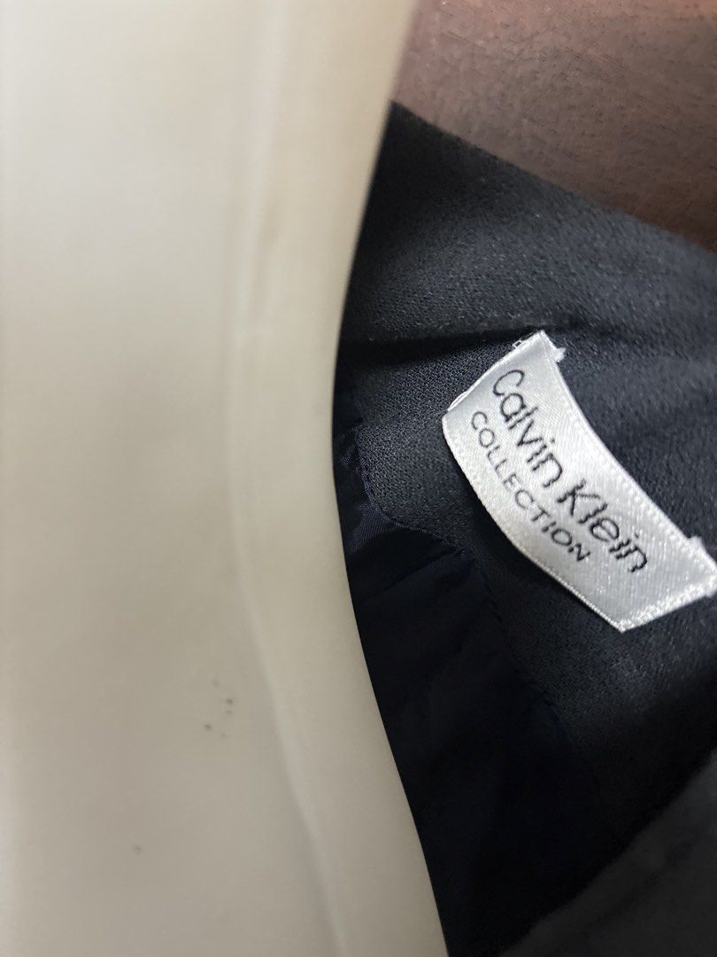 Calvin Klein Black Blazer (Category: Coats, Jackets and Outerwear) located in Caloocan City. Submitted by shibowhii (Listing ID 1470233938, Image 3). Description: - slim fit (it has a nice body hugging fit) - longer than the usual blazer - color rate: 8.5/10.