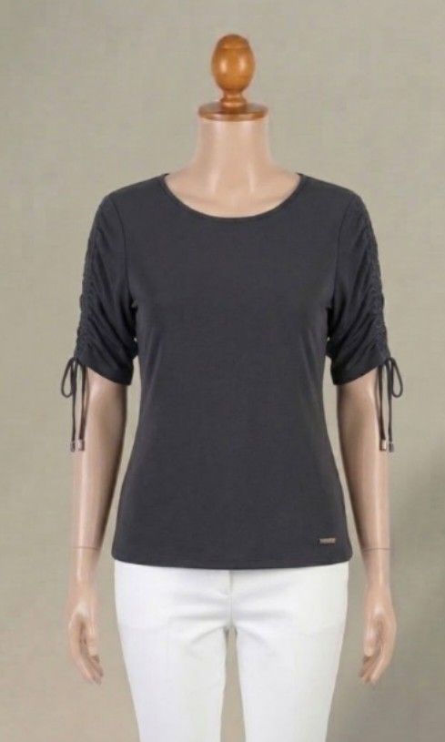 Calvin Klein Dark Grey Charcoal Ruched Sleeve Top (Category: Blouses) located in Quezon City. Submitted by dannikkishoppe2 (Listing ID 1470190459, Image 1). Description: Calvin Klein Dark Grey Charcoal Ruched Sleeve Top‼️₱180‼️ ​adjustable ruched sleeves: create a customized drape with delicate drawstrings and polished metal end-caps. Short or 3/4 length option. large on tag never worn.