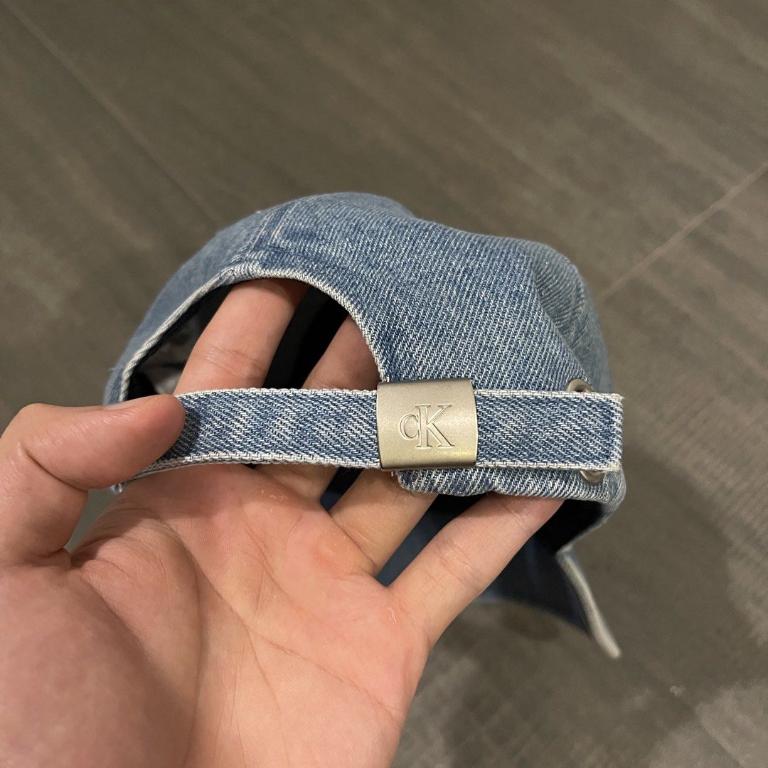 Calvin Klein Denim Baseball Cap (Category: Caps & Hats) located in Manila. Submitted by ig_i.00 (Listing ID 1470237335, Image 2). Description: - Calvin Klein - No issues - Light washed denim baseball cap with navy blue interior lining .
